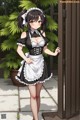 A woman in a maid outfit standing in front of a door.